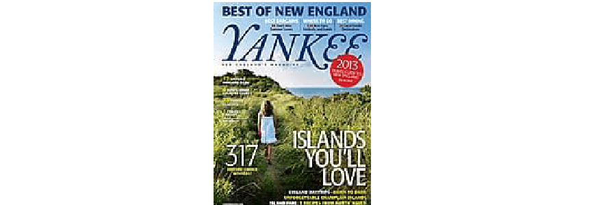 Cover of Yankee magazine featuring a woman in a white dress standing in grassy terrain near the coast, with the title "ISLANDS YOU'LL LOVE."