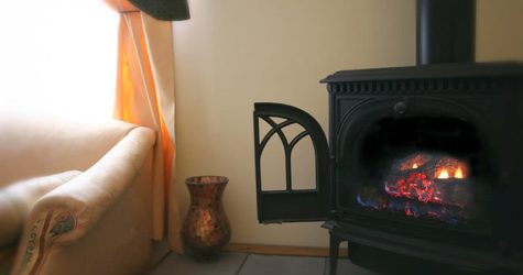 A lit gas fireplace stove