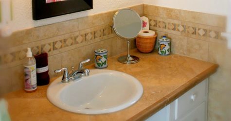 Sink with bath amenities and mirror
