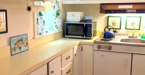 a white and yellow kitchenette
